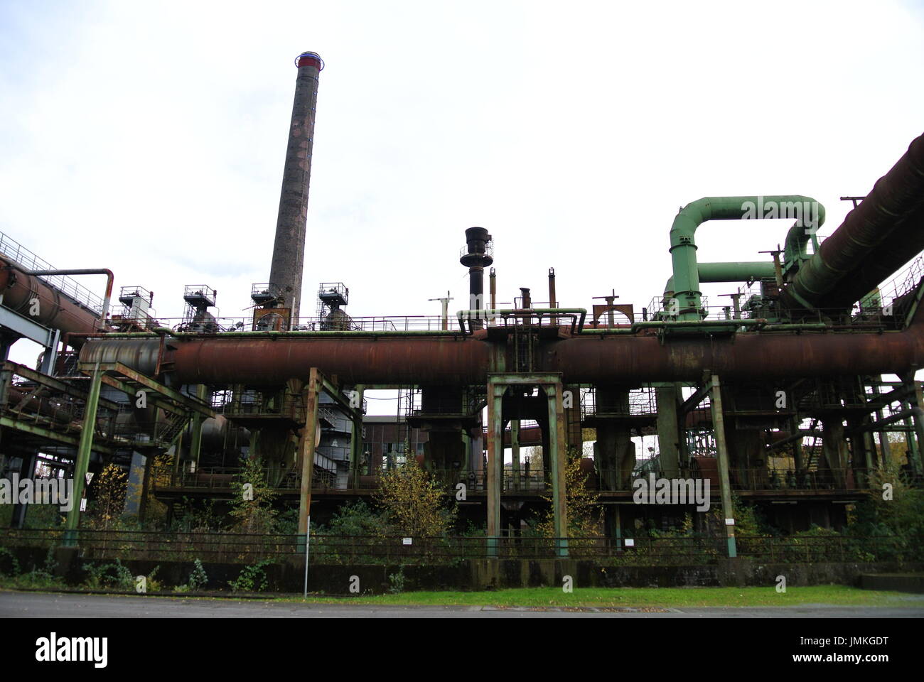 Large chimney and pipes at Landschaftspark Duisburg Nord, Germany Stock Photo