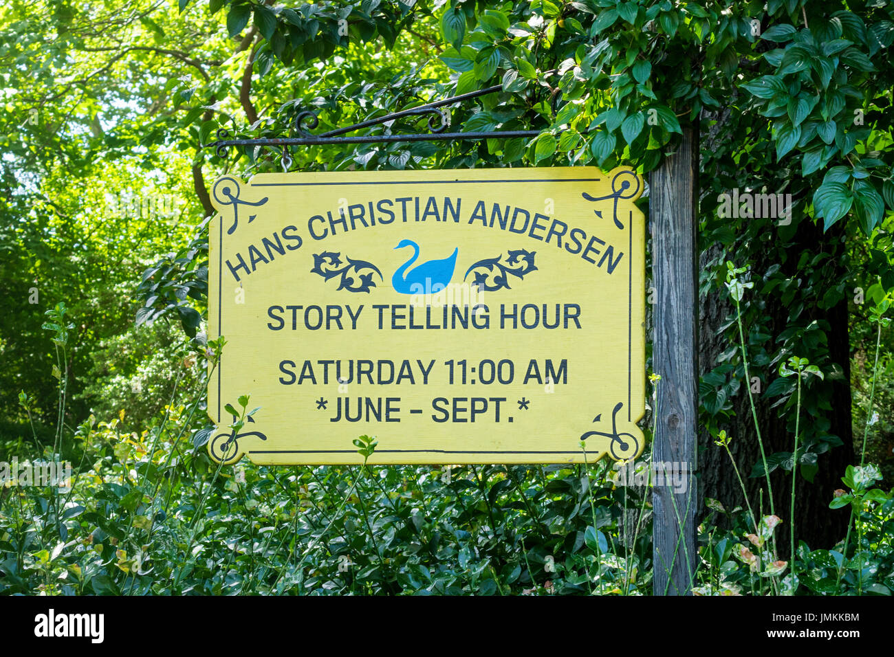 A sign in Central Park displaying the time set aside for the weekly Hans Christian Andersen Story Telling Hour Stock Photo