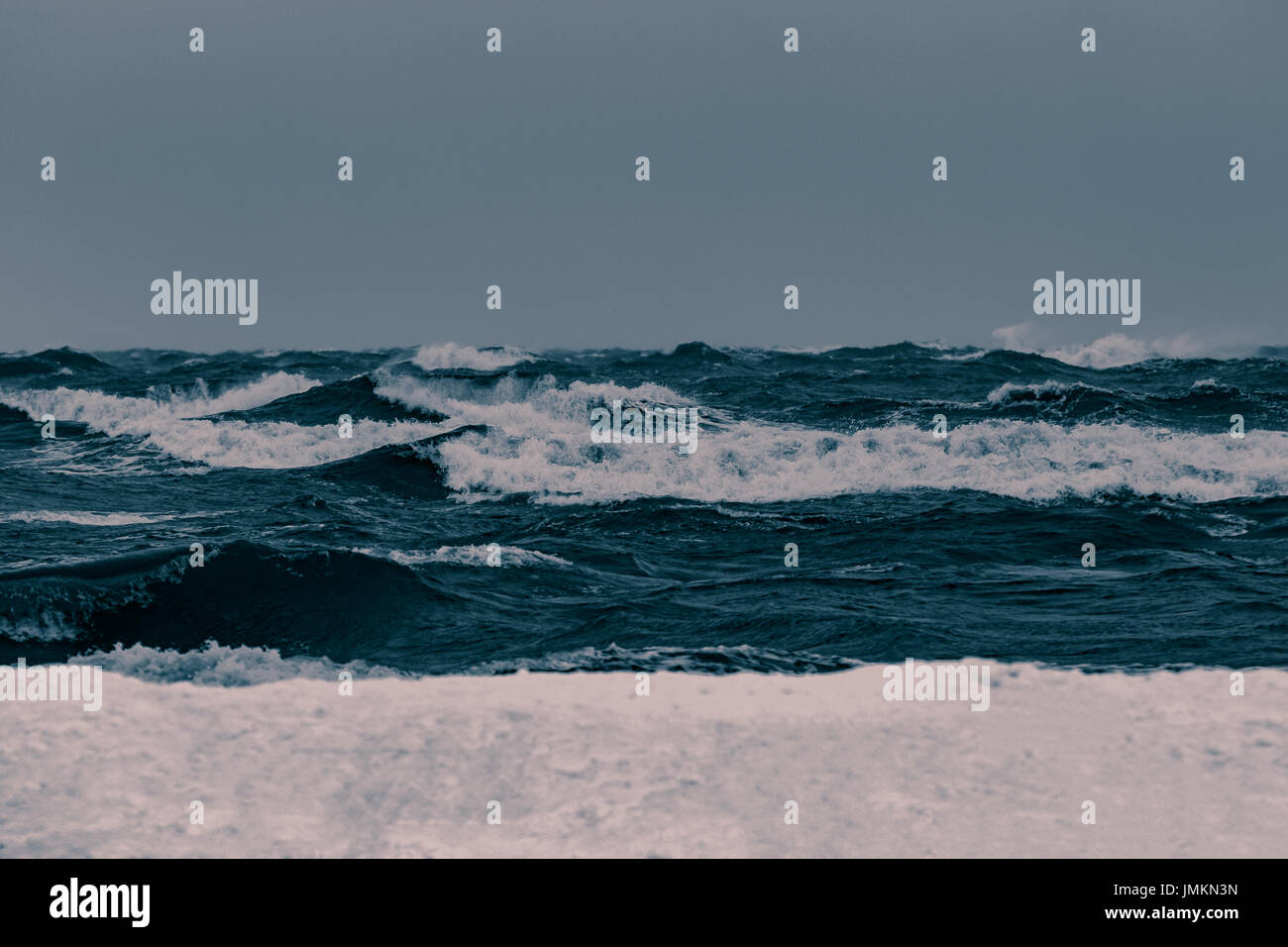 Big waves at the sea in stormy weather. Toned dark blue Stock Photo - Alamy