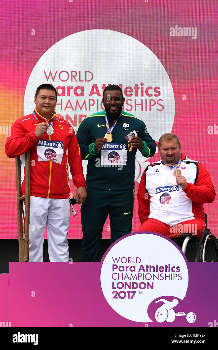 (L to R) Guoshan WU of China (silver) & Thiago Paulino SANTOS of Brazil (gold) & Janusz ROKICKI of Poland (bronze) in the men's Shot Put F57 Final medal ceremony at the World Para Championships in London 2017 Stock Photo