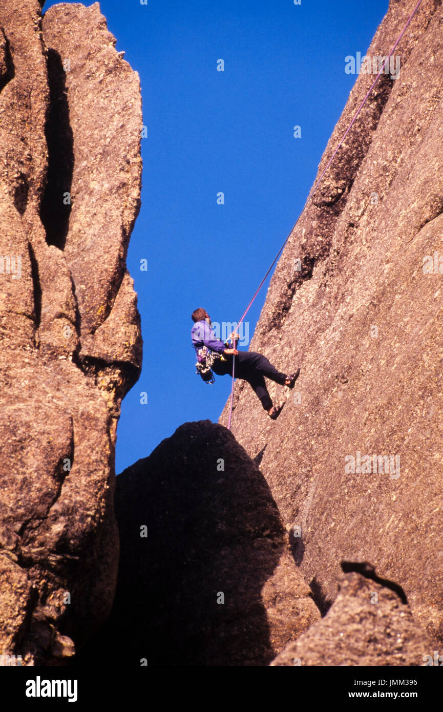 Rock climbers ascend the sheer cliffs on the backside of Mt. Rushmore