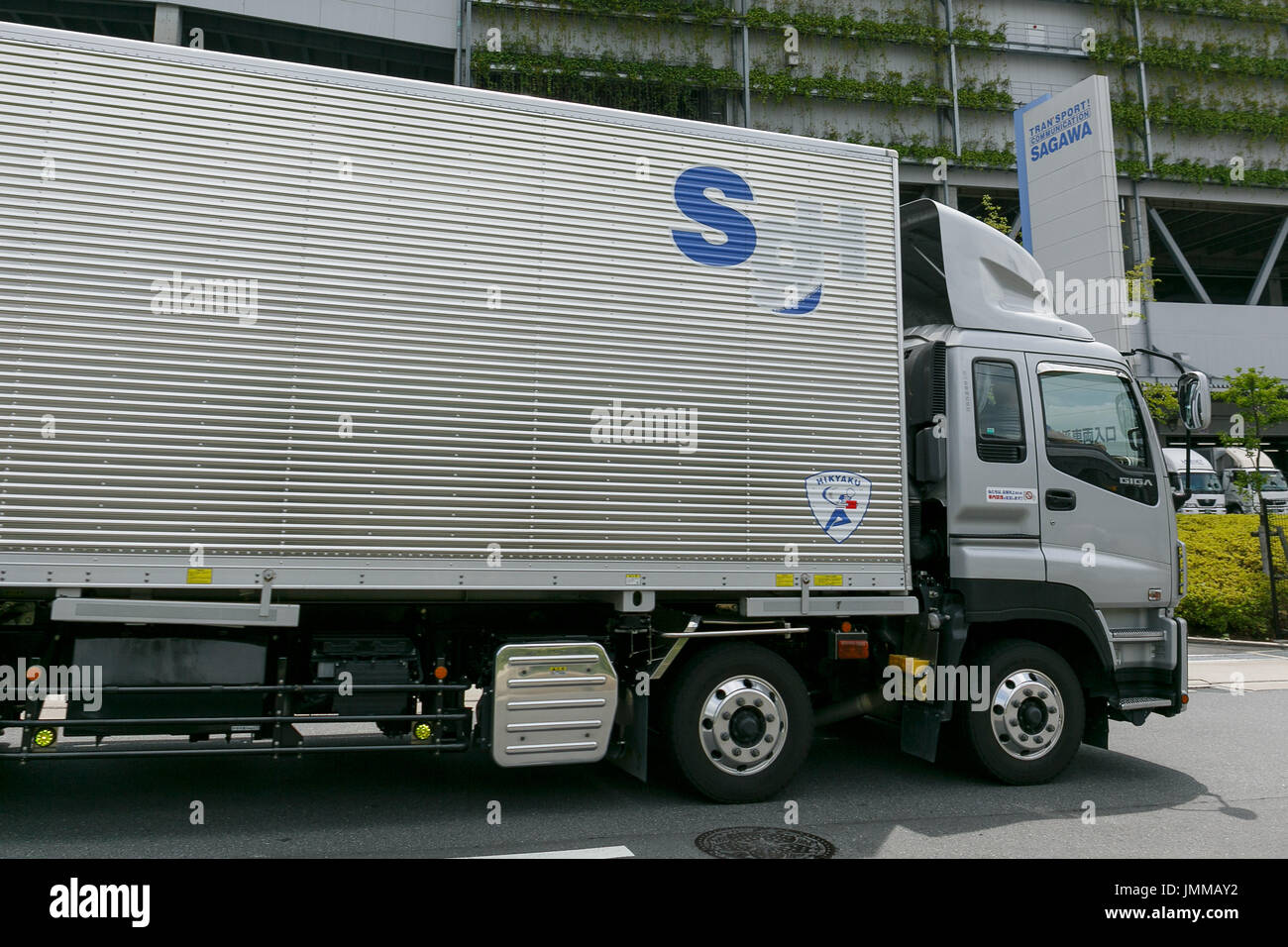 A Sagawa Express delivery truck drives past the Sagawa headquarters on July 28, 2017, Tokyo