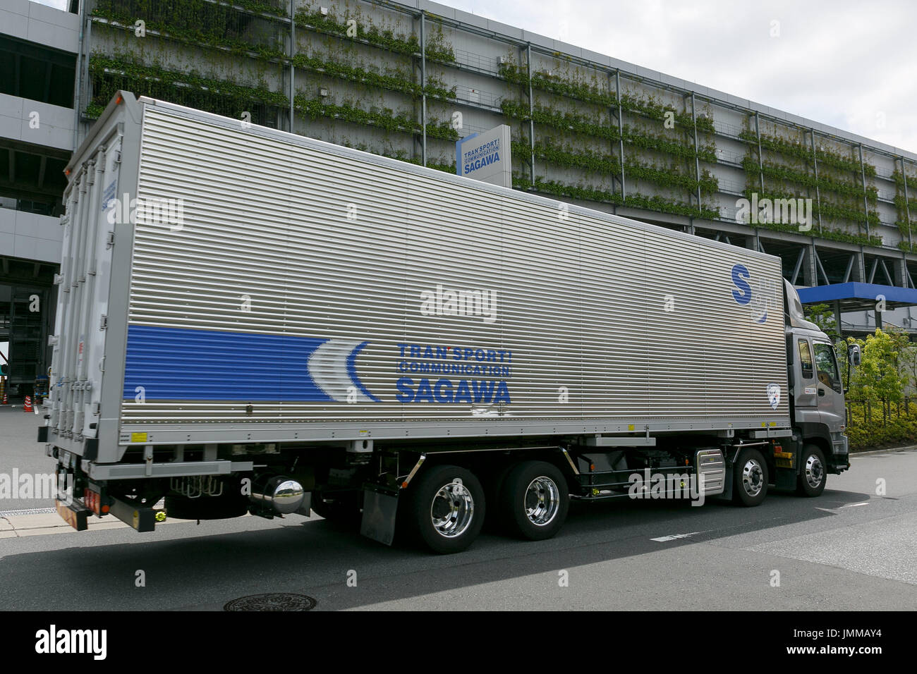 A Sagawa Express delivery truck drives past the Sagawa A Sagawa Express delivery truck drives past the Sagawa