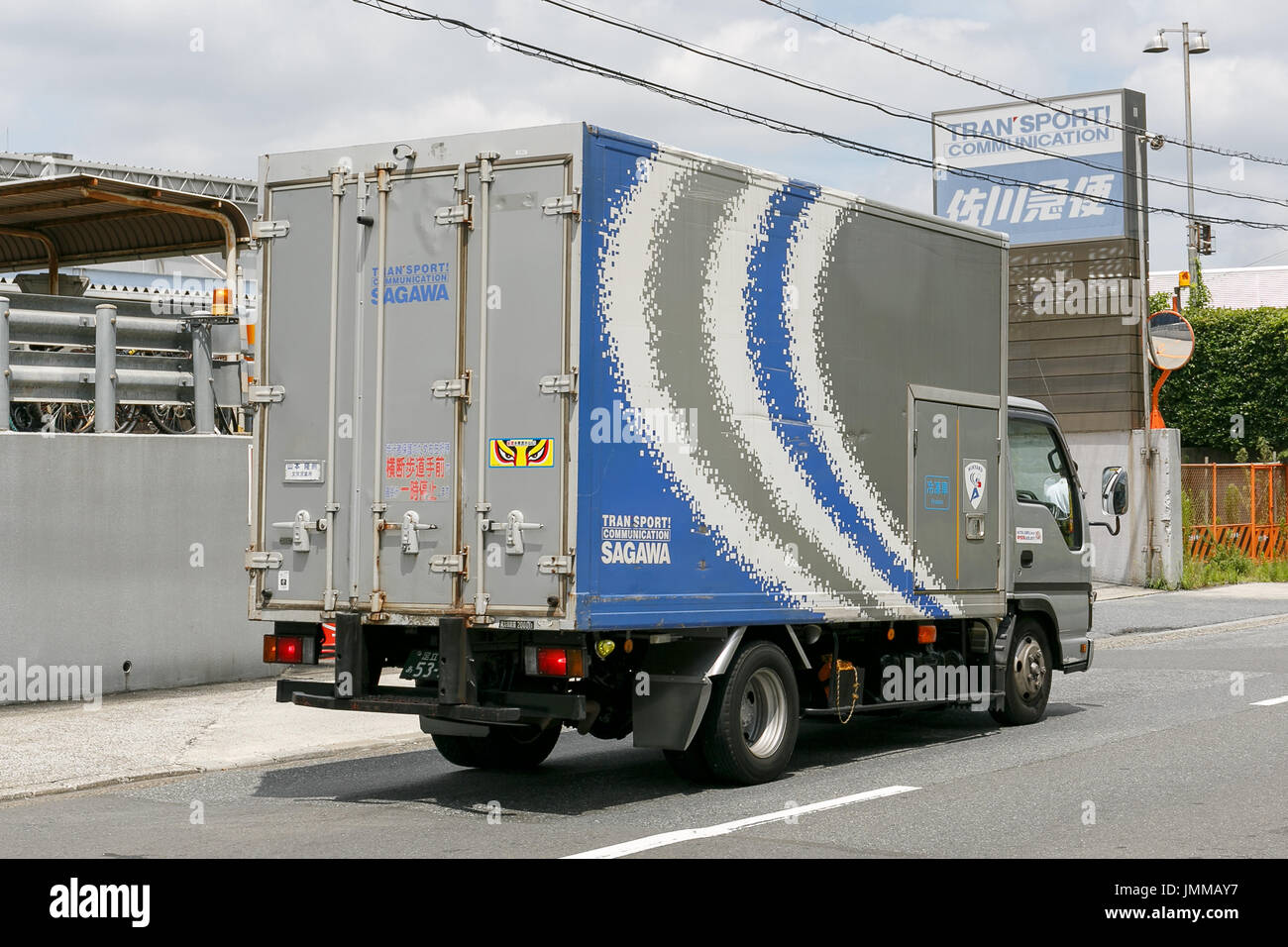 A Sagawa Express delivery truck drives past the Sagawa headquarters on July 28, 2017, Tokyo