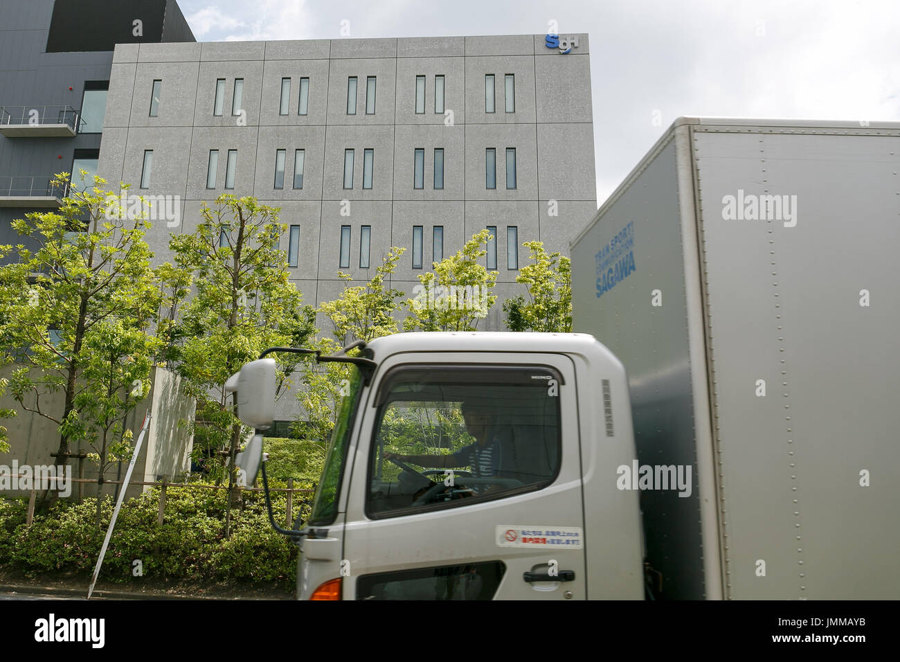 A Sagawa Express delivery truck drives past the Sagawa A Sagawa Express delivery truck drives past the Sagawa