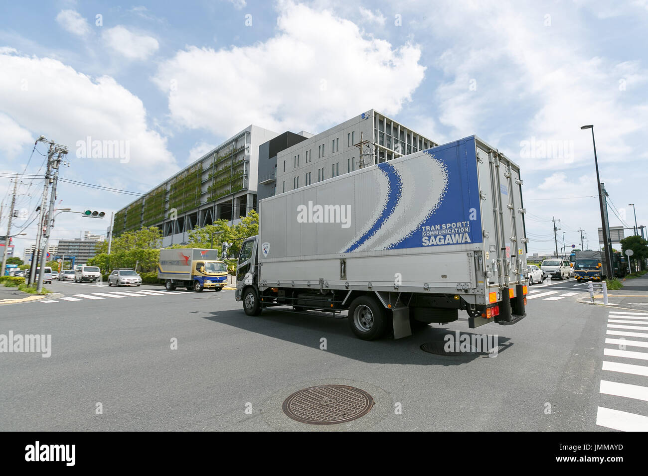 A Sagawa Express delivery truck drives past the Sagawa headquarters on July 28, 2017, Tokyo