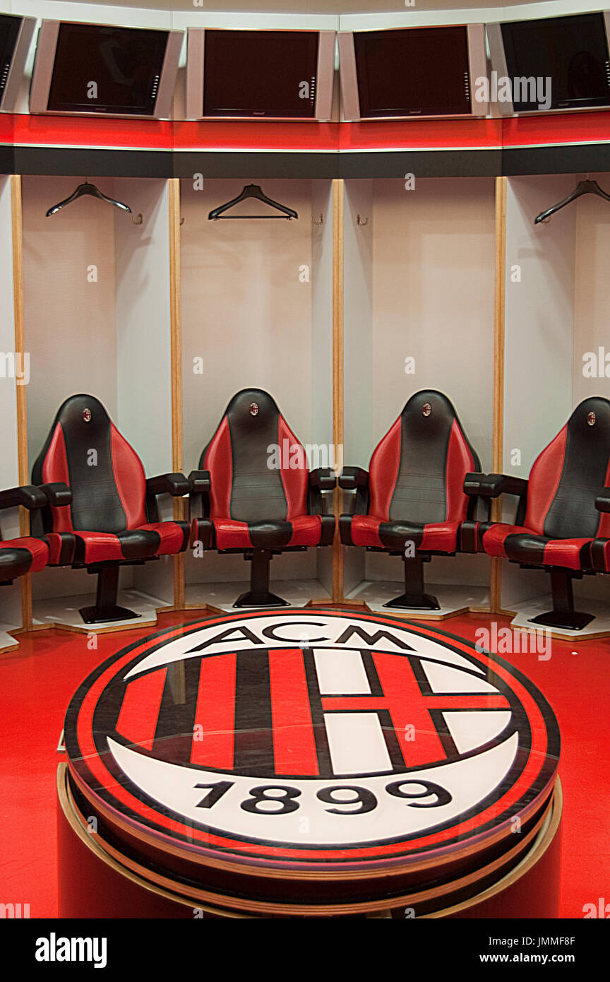 Empty dressing room at San Siro stadium with large table with crest, Milan AC-Milano Stock Photo