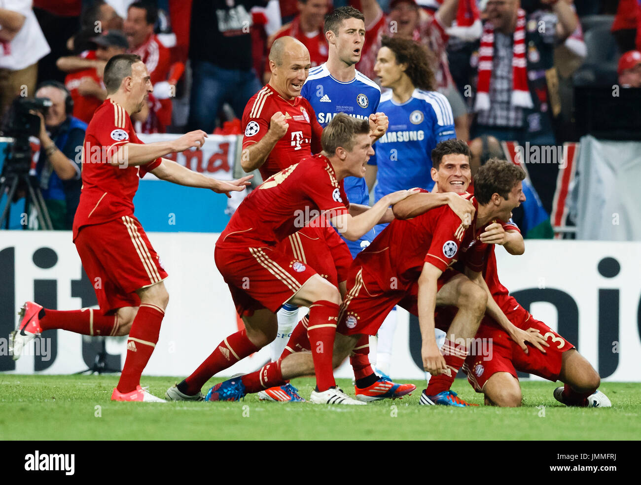 MUNICH, May 19 - Ribery, Robben, Kroos, Gomez and Muller of Bayern celebrate (Cahill, Luiz of Chelsea are behind) during FC Bayern Munich vs. Chelsea FC UEFA Champions League Final game at Allianz Arena on May 19, 2012 in Munich, Germany. Stock Photo