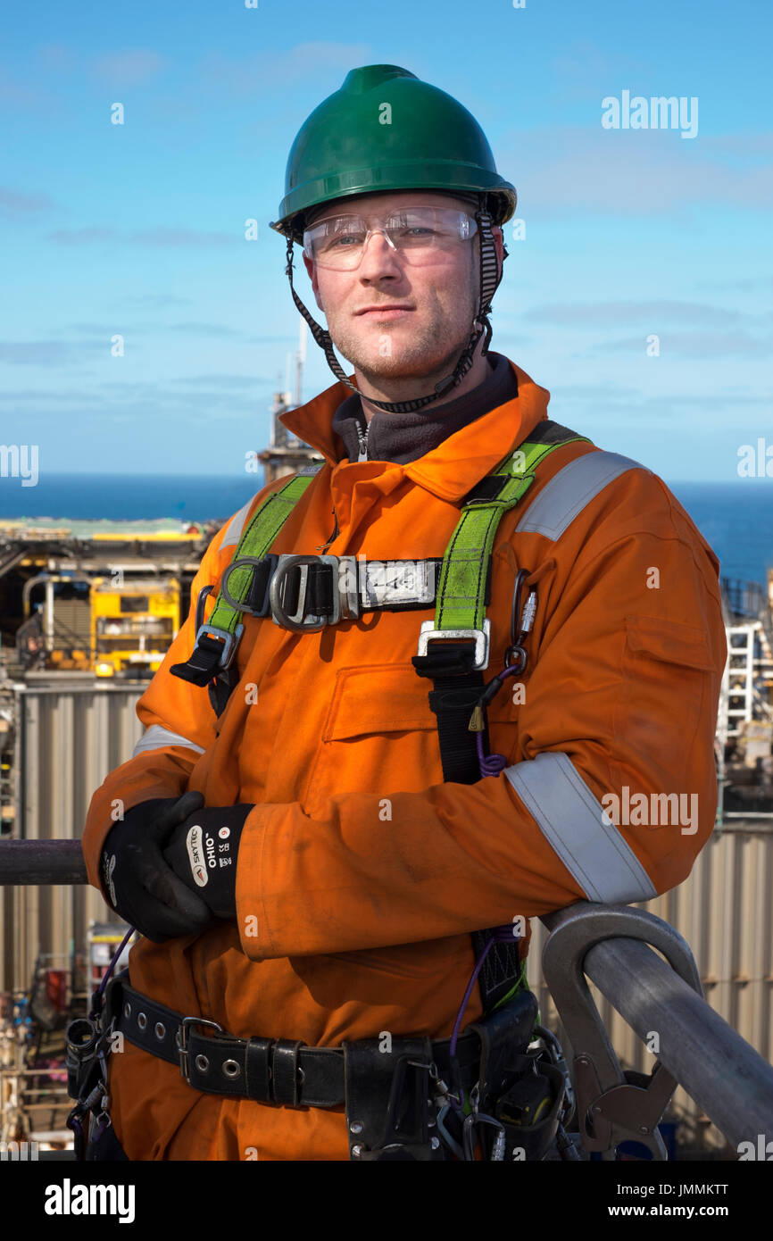 Oil and gas industry, north sea Scaffolder, posing for an image in his orange overalls / coveralls. credit: LEE RAMSDEN / ALAMY Stock Photo