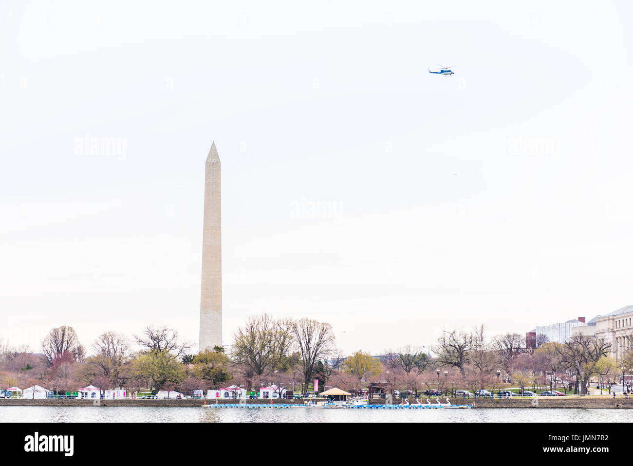 Washington DC, USA March 17, 2017 People walking around Tidal Basin with Washington Monument