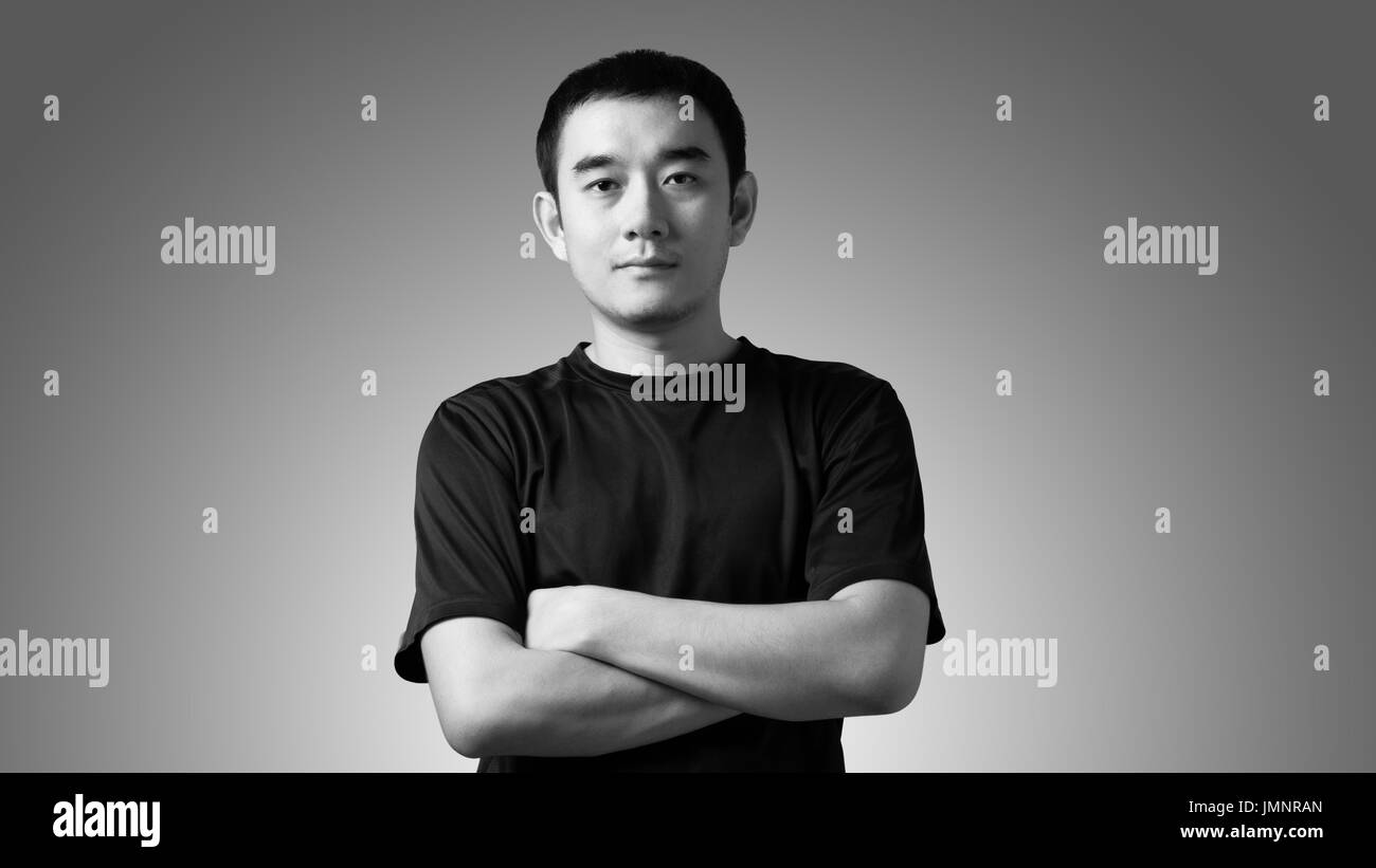 Black and white portrait of a young handsome asian man Stock Photo
