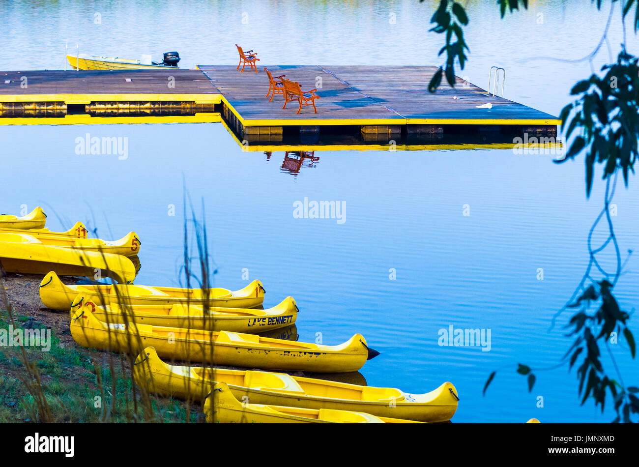 A Yellow Rimmed Floating Pontoon With Red Bench Seats Yellow
