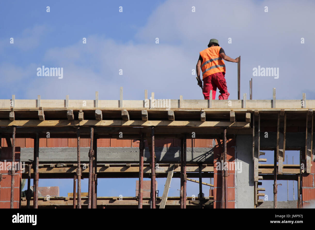 Mason on the construction site Stock Photo