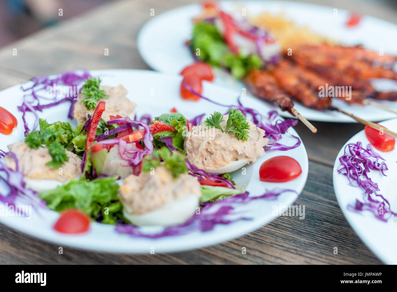 Eggs filled with tuna spread and vegetable salad Stock Photo Alamy
