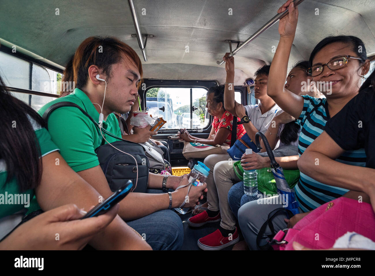 Jeepney passengers, Angeles City, Pampanga, Philippines Stock Photo