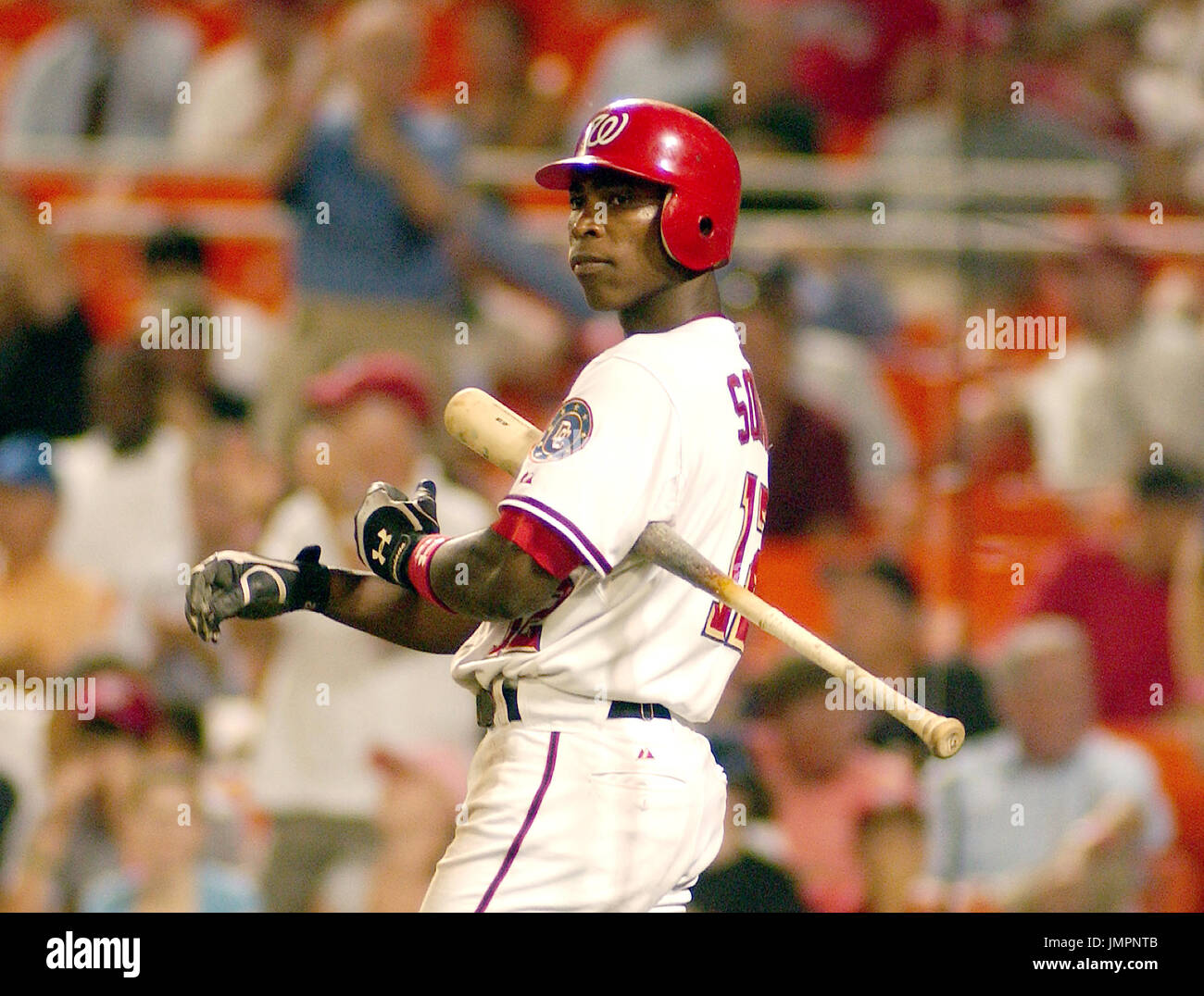 Washington Nationals (12) Alfonso Soriano makes the safe sign after being  thrown out at home plate in the 8th inning at Shea Stadium in New York City  on April 4, 2006. The