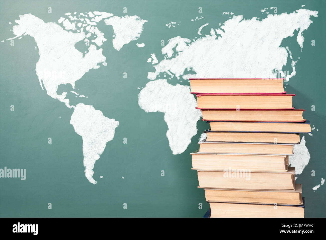 Books and chalk drawing of World map Stock Photo