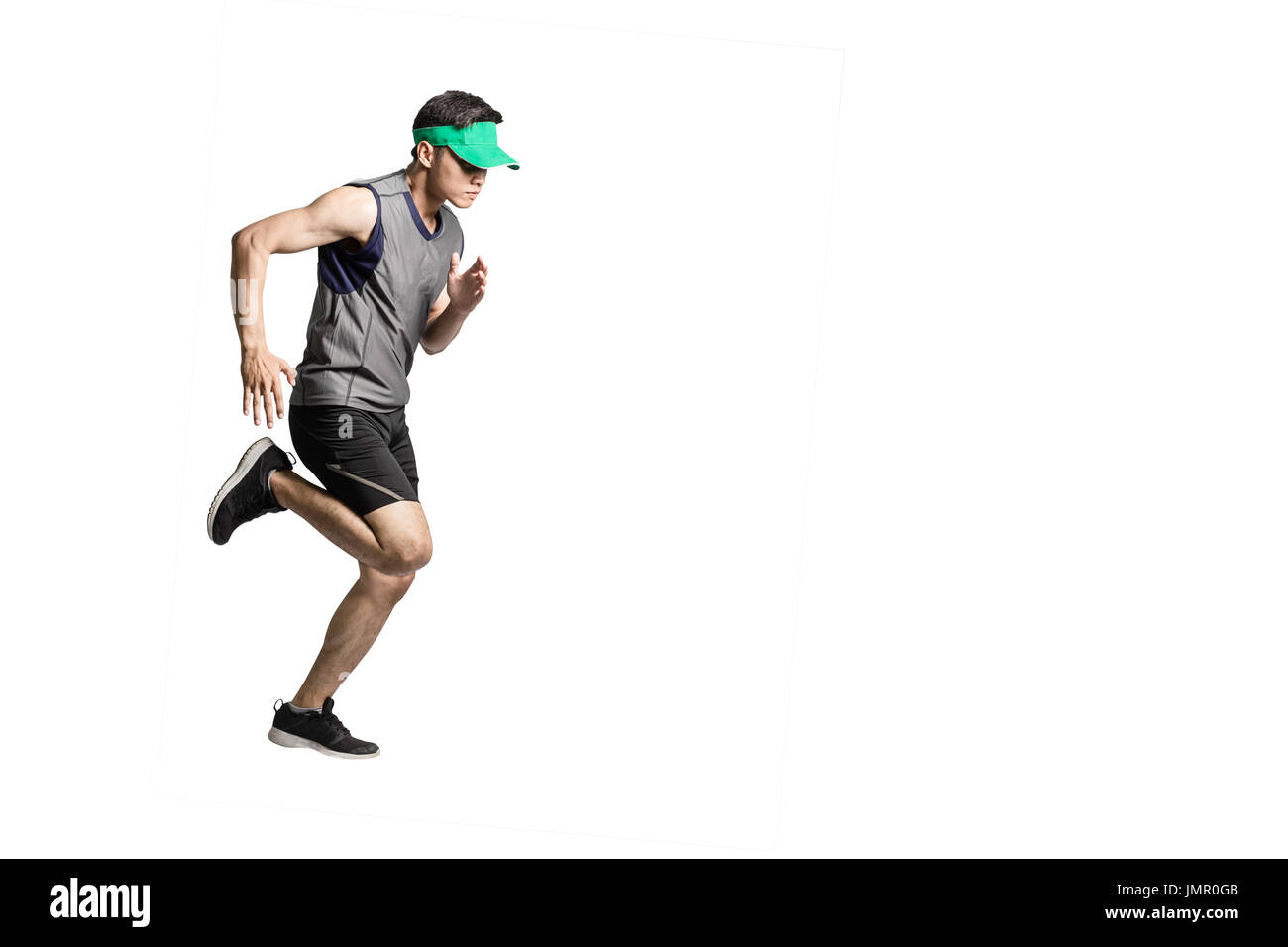 Portrait of an asian sport man wearing sportwear and green visor for running. Isolated full length on white background with copy space Stock Photo