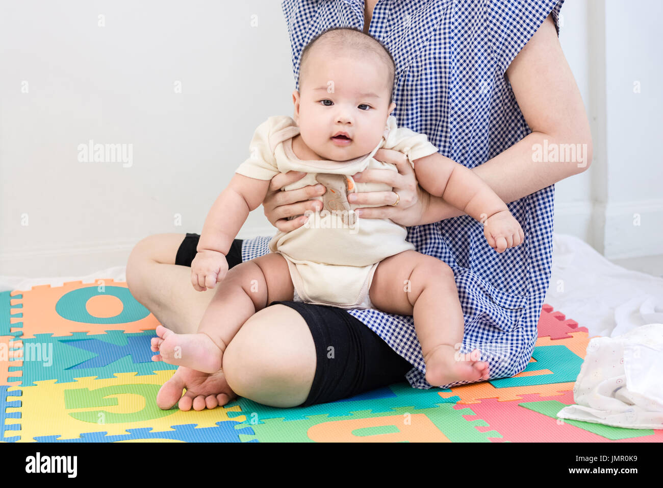 Mom holding son on lap hires stock photography and images  alamy