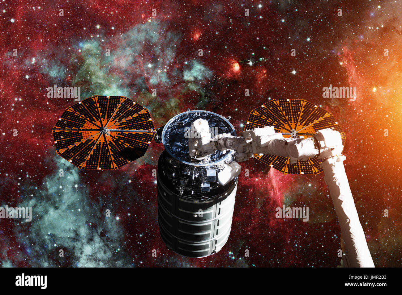 Cargo spacecraft - The Automated Transfer Vehicle over spiral galaxy. Elements of this image furnished by NASA. Stock Photo