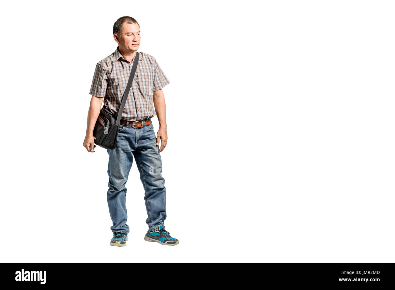 Portrait of a happy mature man standing in scott shirt and blue jeans  looking to the right side. Isolated full length on white background with  copy sp Stock Photo - Alamy