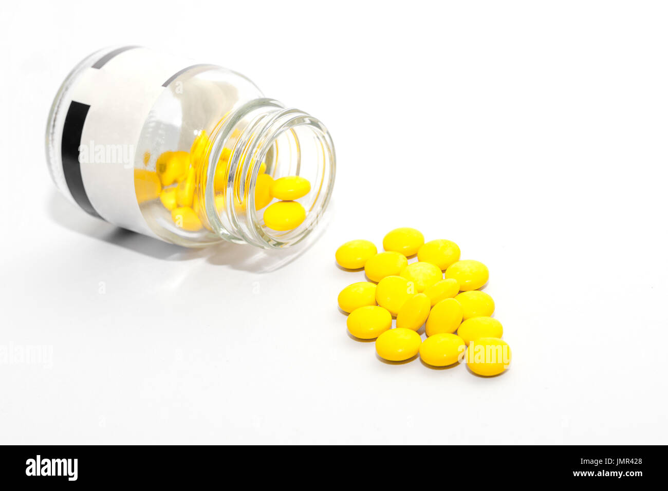 Yellow pills. isolated on white background Stock Photo