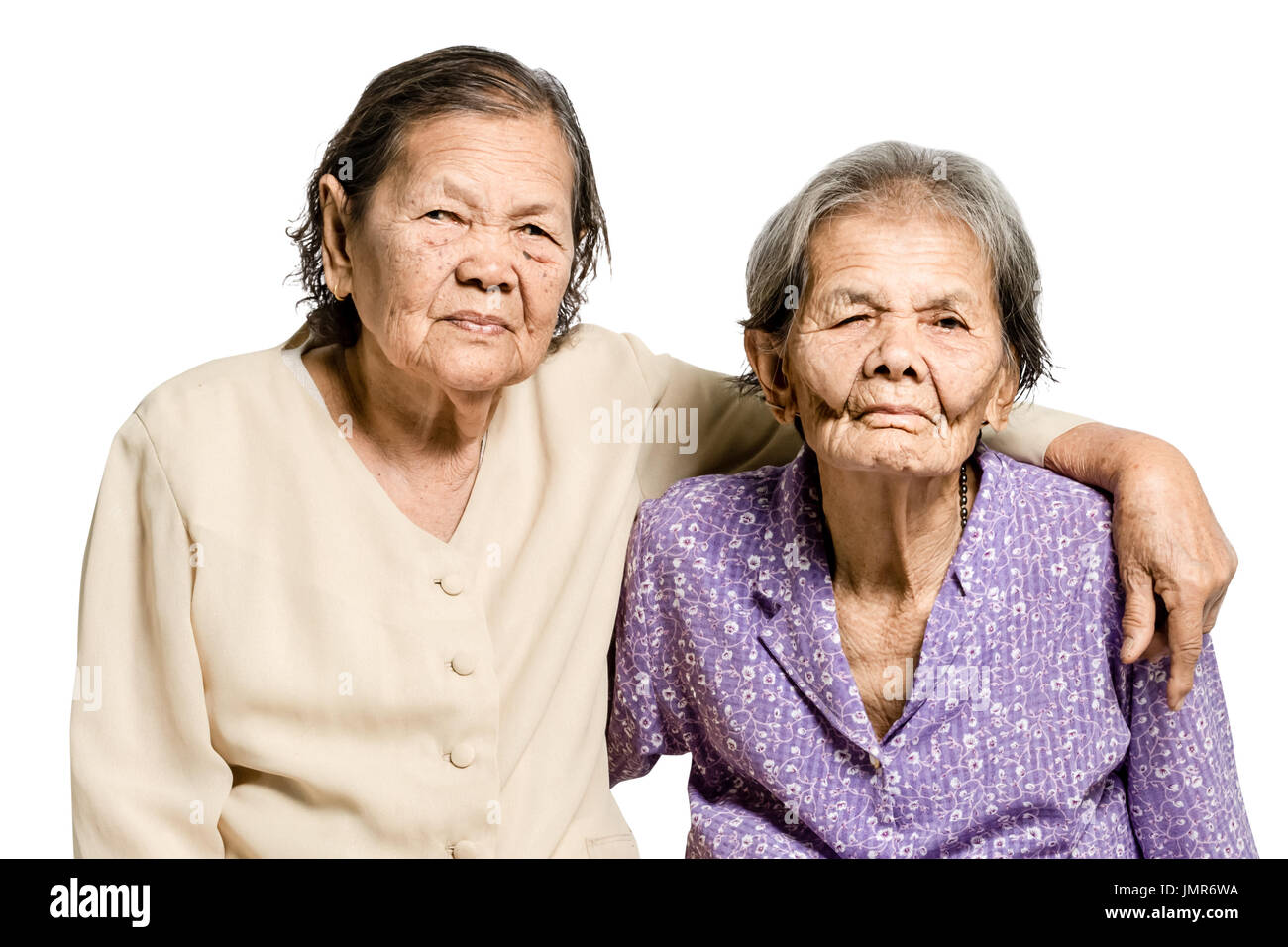 Portrait of senior asian women hugging her sister. Isolated on white background with  clipping path Stock Photo