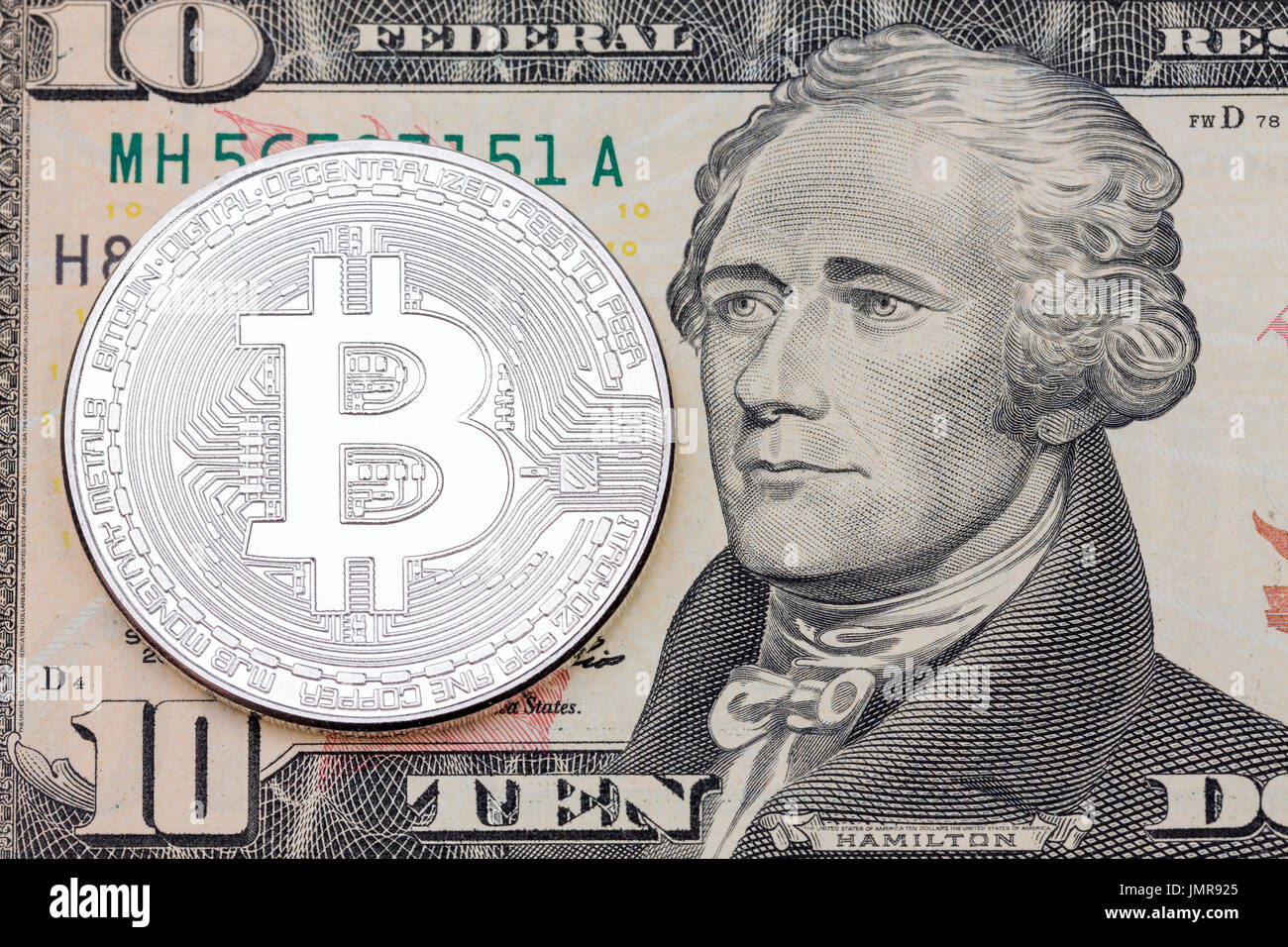 bitcoin symbol on ten dollars background. cryptocurrency technologies  concept. virtual money with real life Stock Photo - Alamy