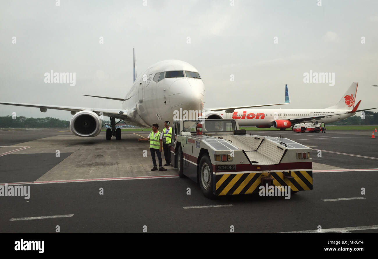 Yogyakarta, Indonesia - Apr 15, 2016. Civil airplanes docking at Adisutjipto Airport in Yogyakarta, Indonesia. The Airport is the 4th busiest airport  Stock Photo