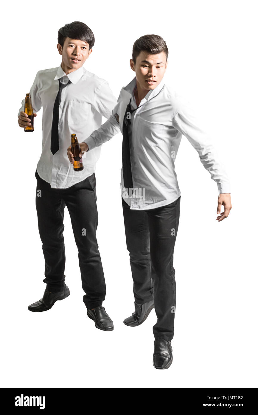 portrait of two asian business man with bottled beer . Isolated on white background with copy space and clipping path Stock Photo
