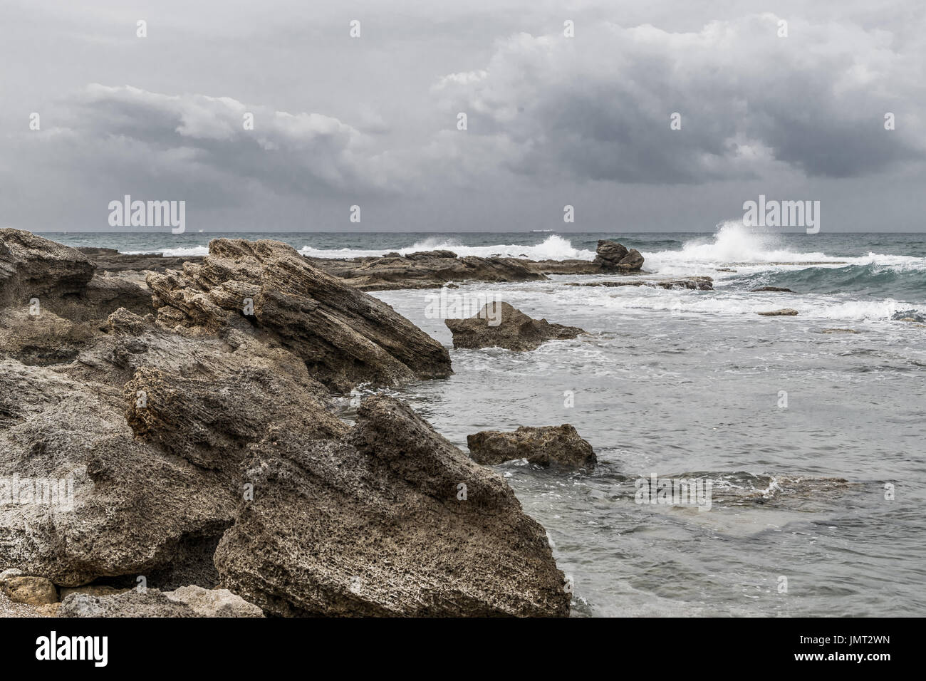 Caesarea Maritima - beach rocks blueish Stock Photo