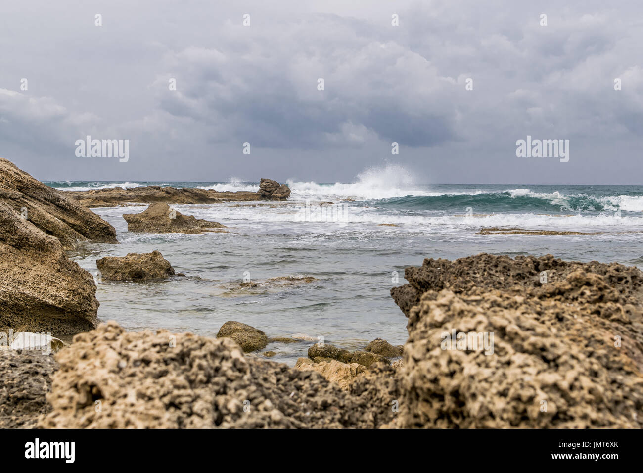 Caesarea Maritima - beach rocks and wild waves Stock Photo