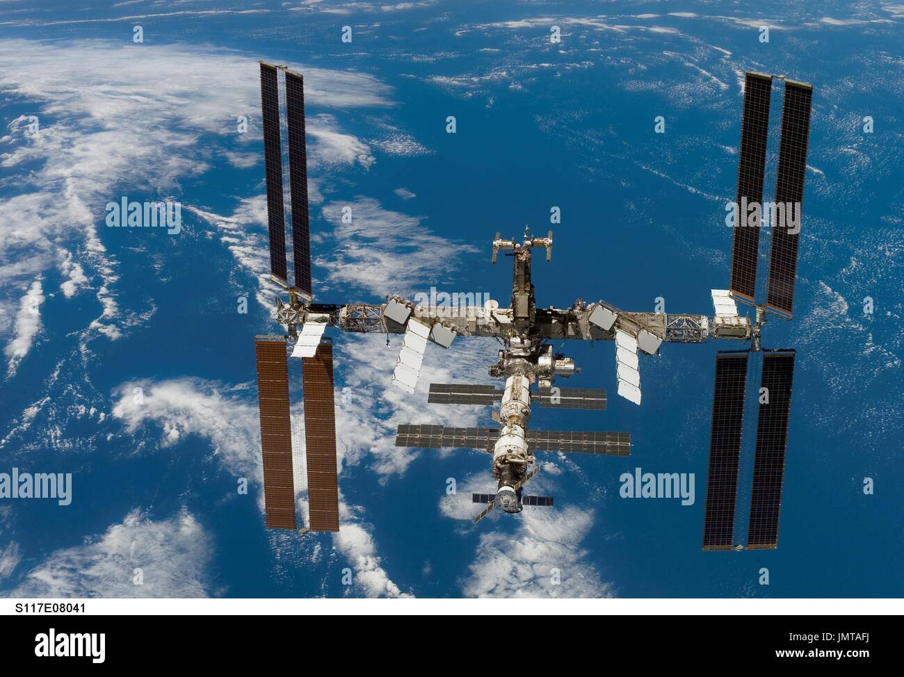 In Earth Orbit - June 19, 2007-- Backdropped by a blue and white Earth ...