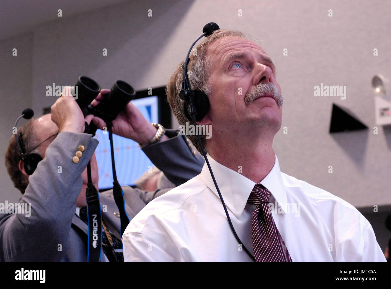 Kennedy Space Center, FL - August 8, 2007 -- National Aeronautics and Space Administration (NASA) Associate Administrator for Space Operations, Bill Gerstenmaier (foreground) watches the launch of the Space Shuttle Endeavour (STS-118) from the Launch Control Center Wednesday, August 8, 2007, at the Kennedy Space Center in Cape Canaveral, Florida. The Shuttle lifted off from launch pad 39A at 6:36p.m. EDT.  Credit: Bill Ingalls - NASA via CNP Stock Photo