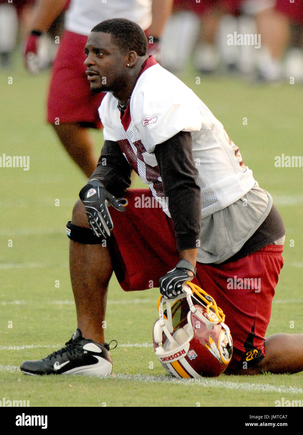 New York Giants Michael Johnson (20) holds up Washington Redskins Clinton  Portis (26) in the first quarter at Giants Stadium in East Rutherford, New  Jersey on September 4, 2008. The Giants defeated