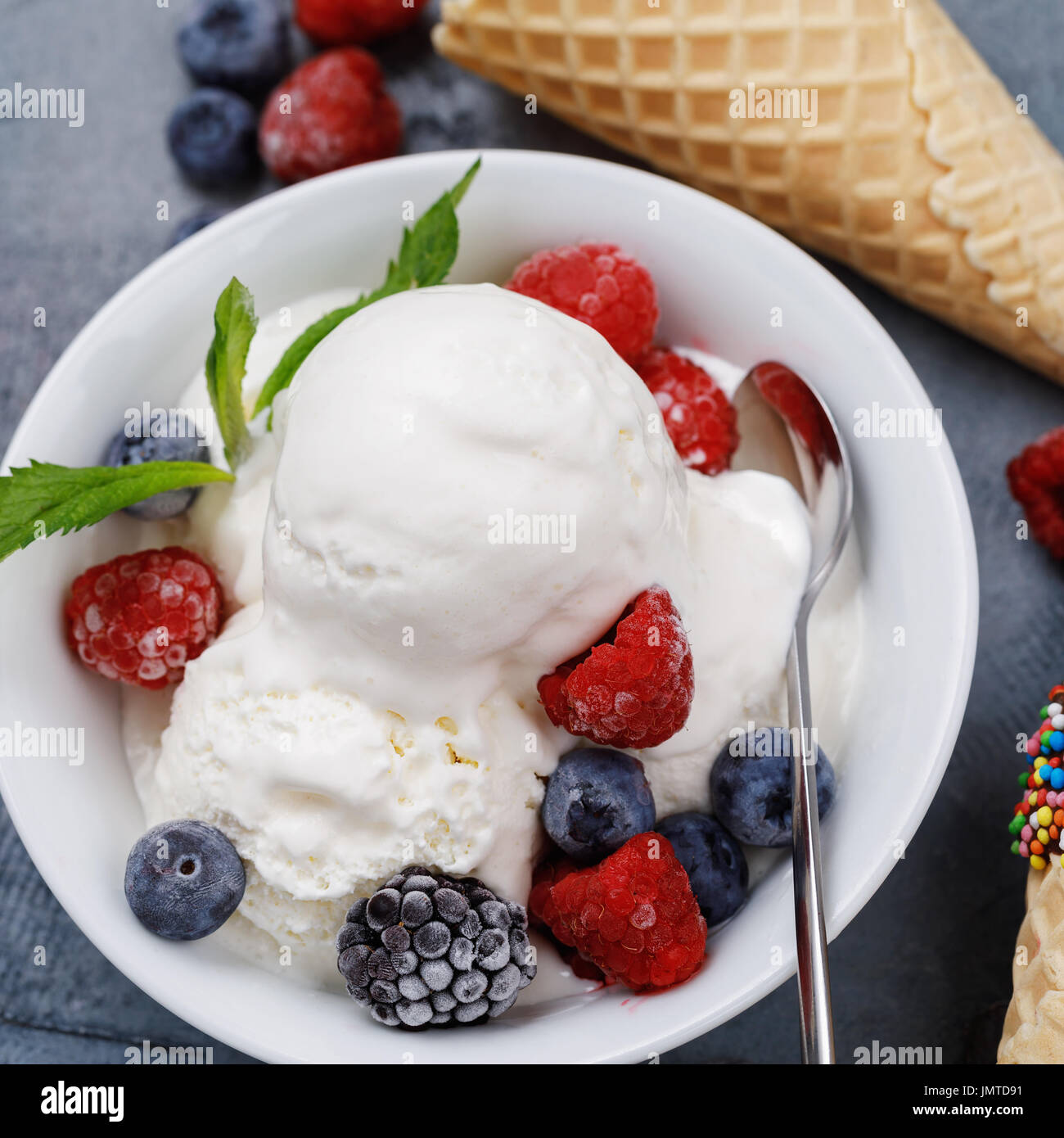 Vanilla ice cream scoops with fresh berries, closeup Stock Photo - Alamy