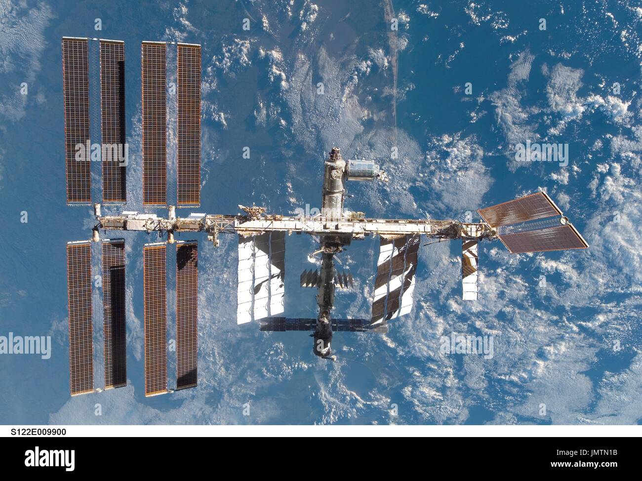 In Earth Orbit - February 18, 2008 --- Backdropped by a blue and white ...
