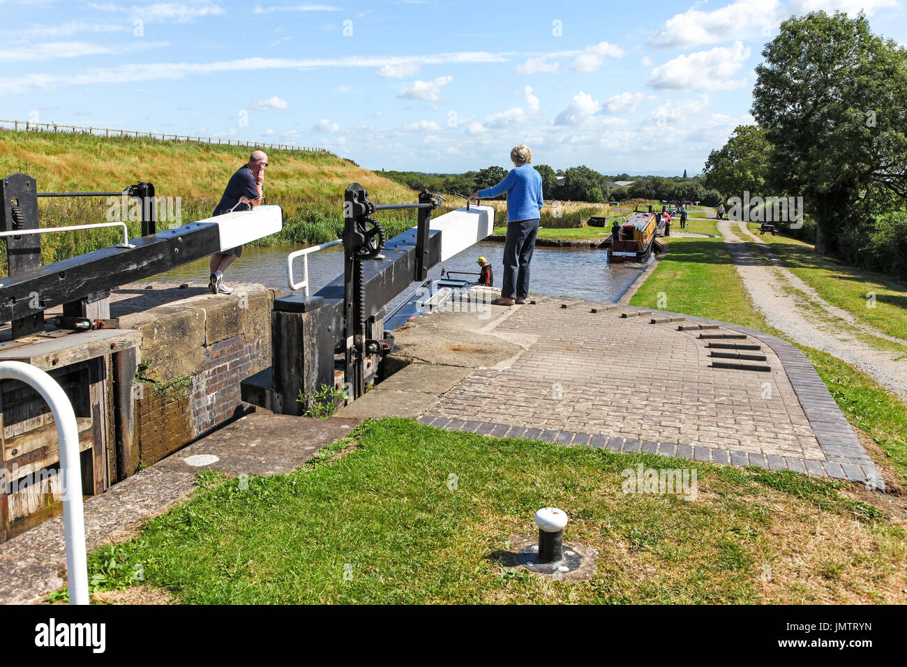 Barges or narrow boats on the Hurleston flight of locks at Hurleston  Junction on the Llangollen Canal Cheshire England UK Stock Photo