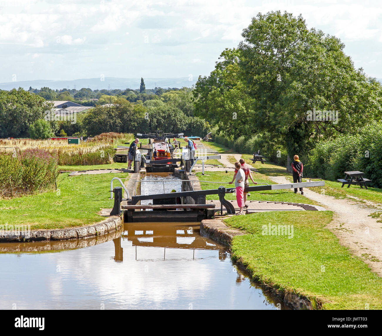 Barges or narrow boats on the Hurleston flight of locks at Hurleston  Junction on the Llangollen Canal Cheshire England UK Stock Photo