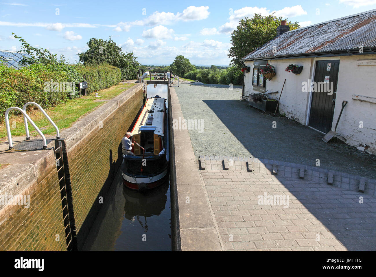 A barge or narrow boat in the lock at the top of the Hurleston flight of locks at Hurleston  Junction on the Llangollen Canal Cheshire England UK Stock Photo