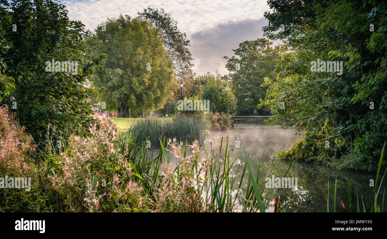 Picturesque views of the historic Lincolnshire town of Stamford taken from the Town Meadows featuring mist rising on the River Welland. Stock Photo
