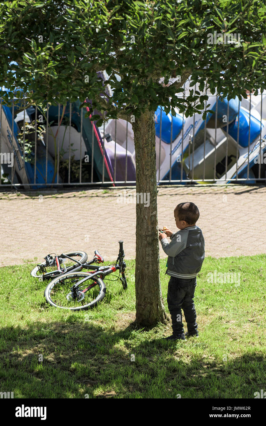 A young boy playing on his own. Stock Photo