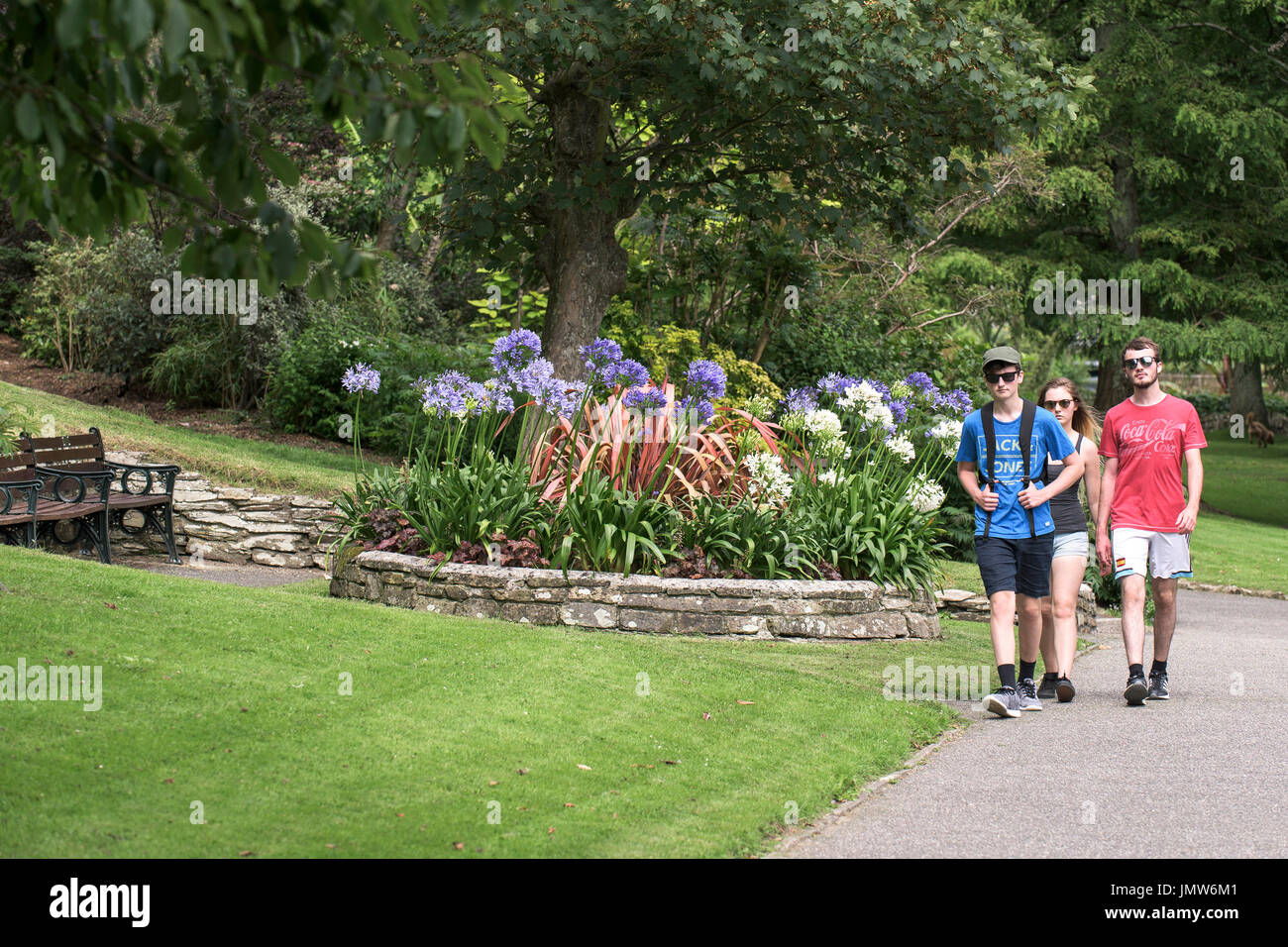 People walking though Trenance Gardens in Newquay, Cornwall. Stock Photo