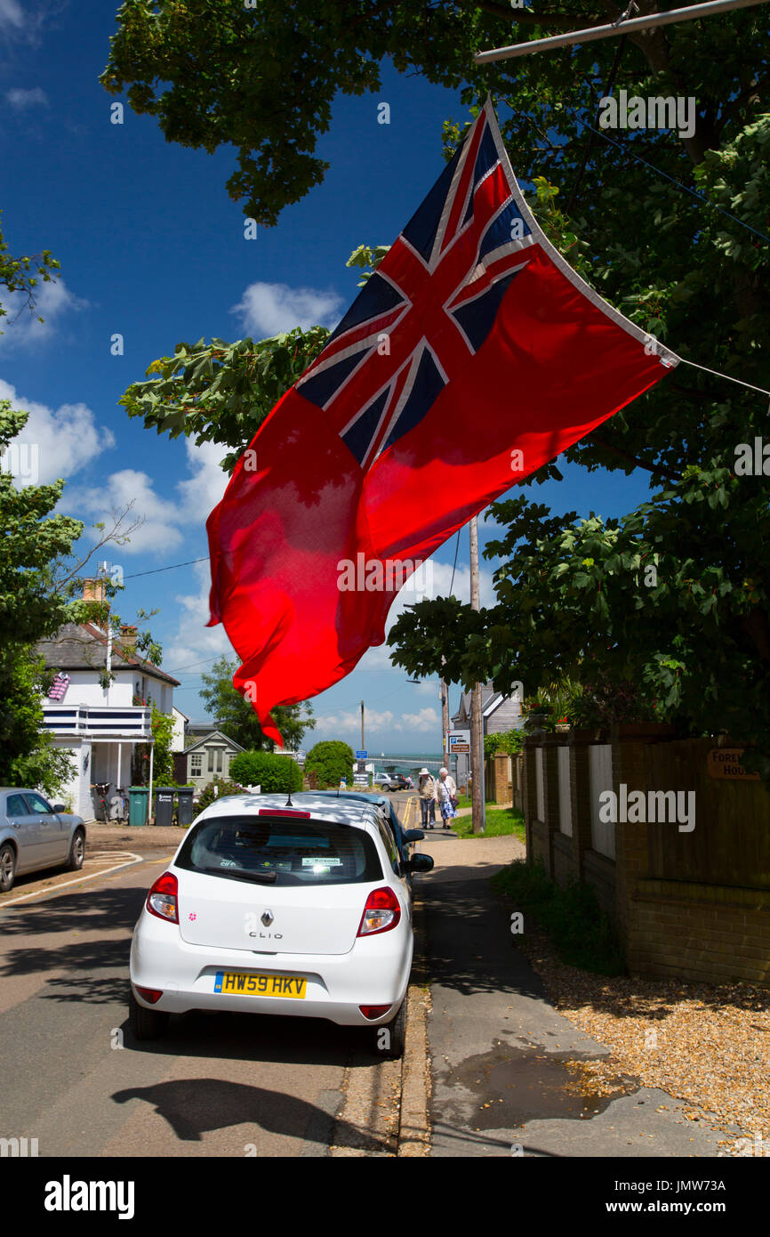 large red ensign flag. flying over pavement. Bembridge, Isle of Wight, UK, Stock Photo