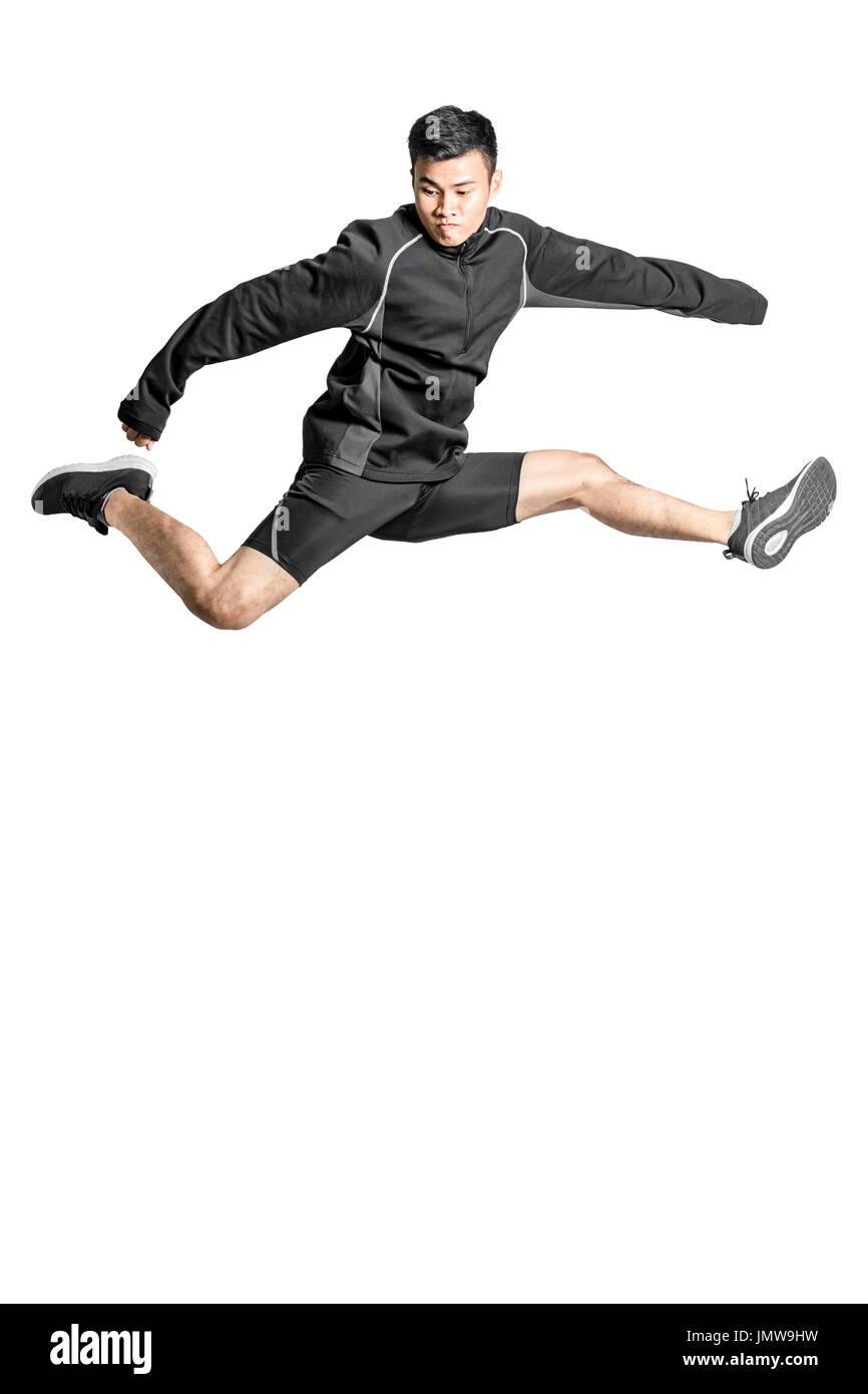 Portrait of an asian sport man jumping. Isolated full length on white background with copy space and clipping path Stock Photo
