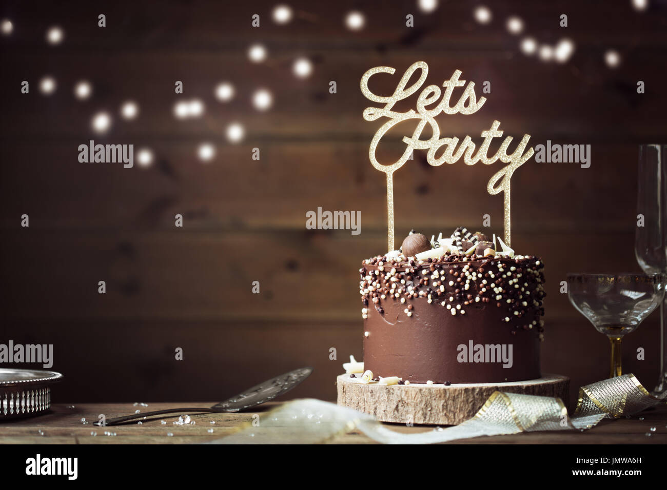 Chocolate celebration cake in a party setting Stock Photo
