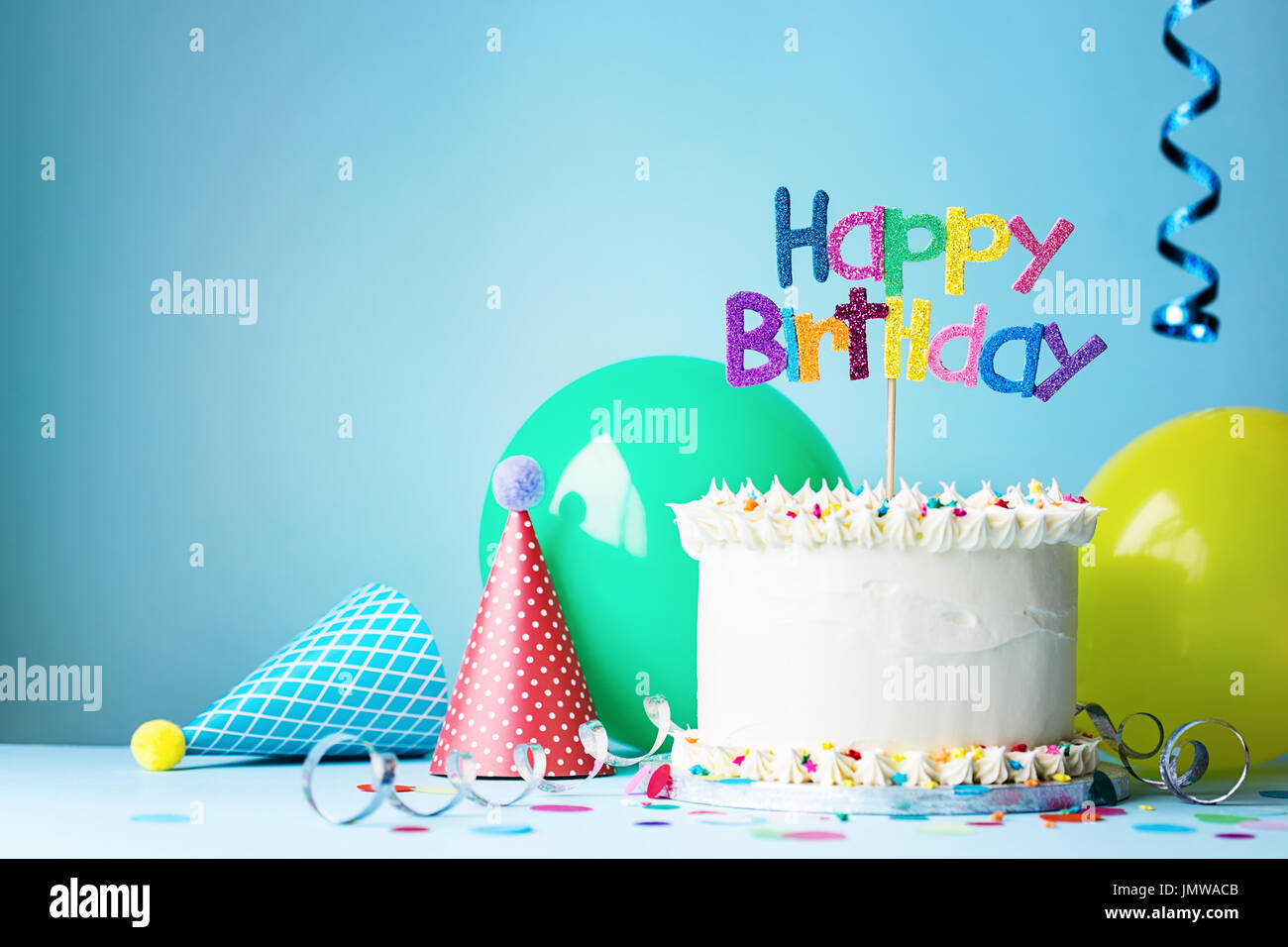 Birthday cake with colorful greeting Stock Photo