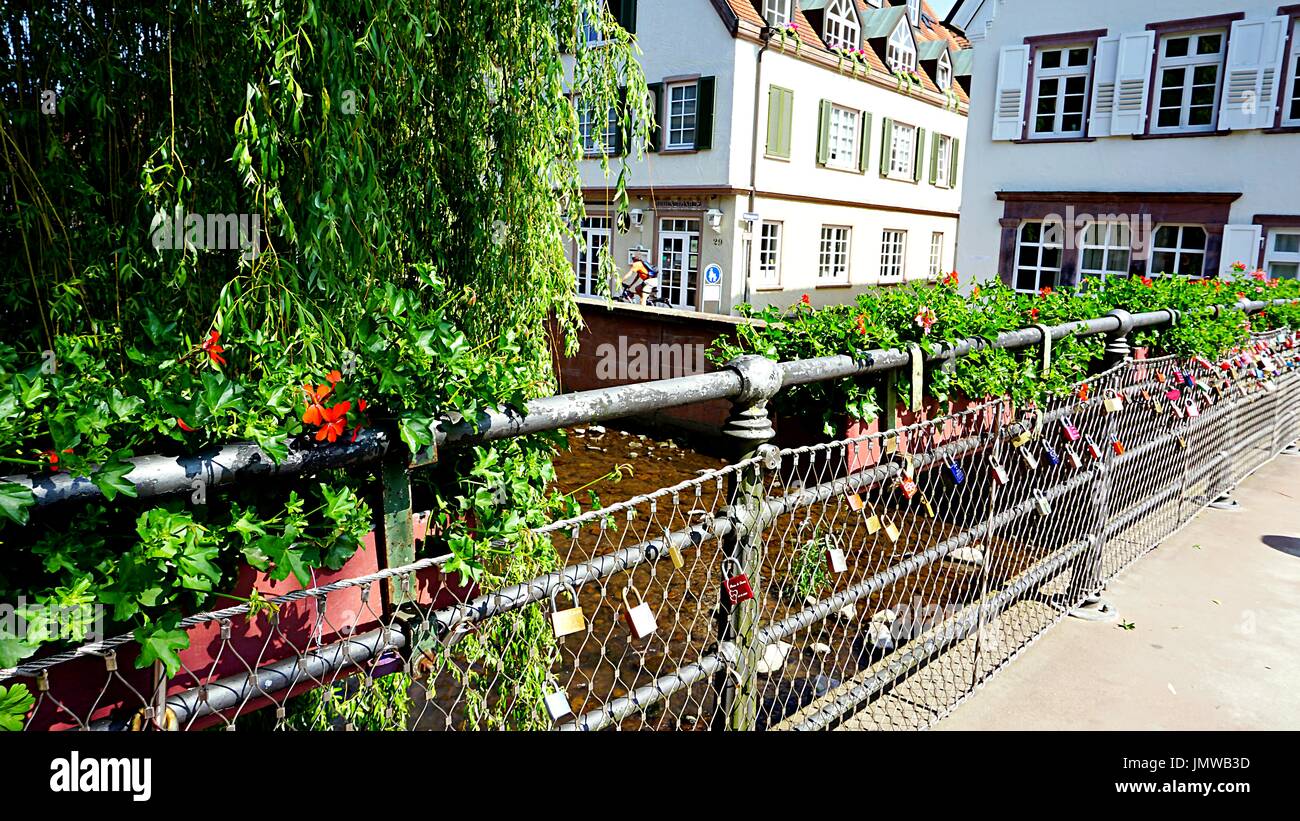 German style housing buildings and bridge across Alb river in Ettlingen