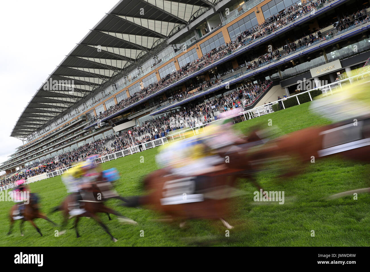 Runners pass the stands for the first time during The John Guest Brown Jack Handicap Stakes on day one of King George VI Weekend at Ascot Racecourse, Berkshire. Stock Photo