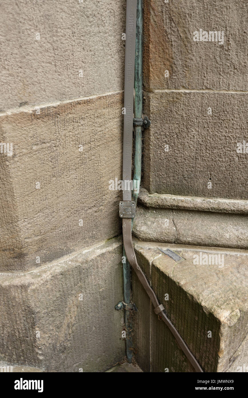 Lightning conductor fixed to church wall at all saints church stand in